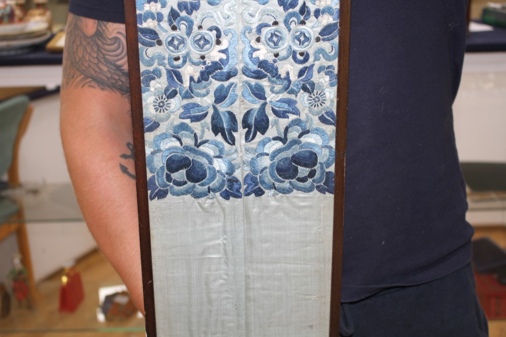 A Chinese silkwork double sleeve panel, 77 x 18cm overall, a smaller floral panel, 61 x 11cm and another, 34 x 26cm overall